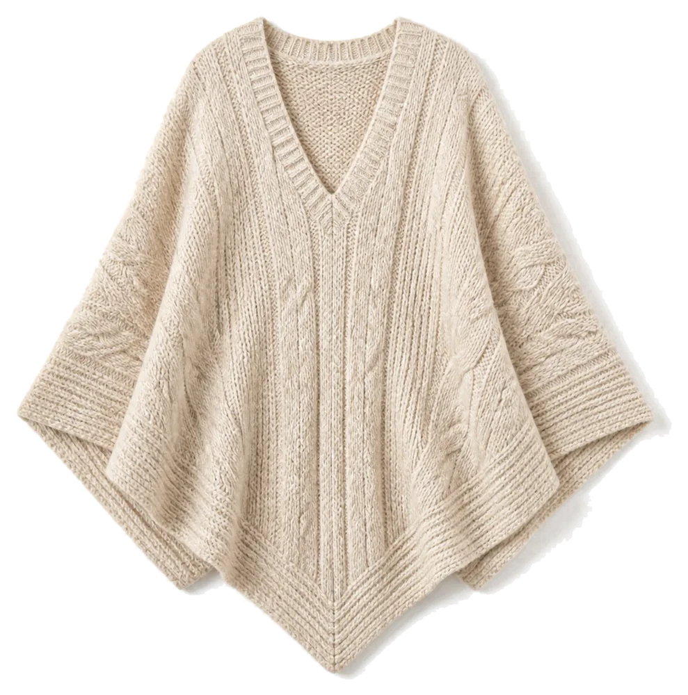 Oatmeal knitted poncho on a pale studio background, product concept