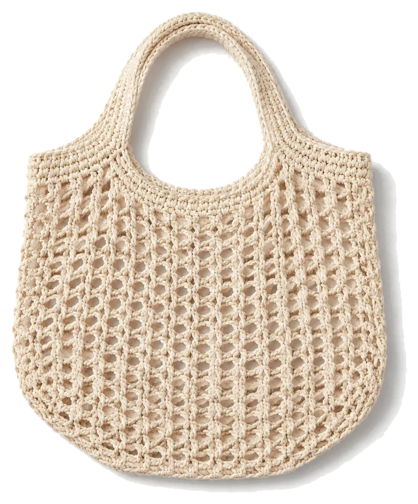 Ivory crochet market tote on a pale studio background, product concept